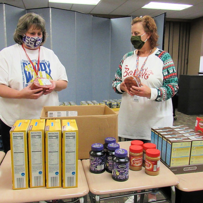 Opportunity Now Staff Packing Food Boxes