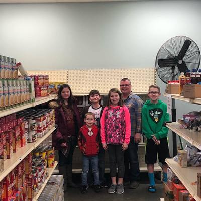 Youth learning about the ministry of the Salina Emergency Aid/Food Bank