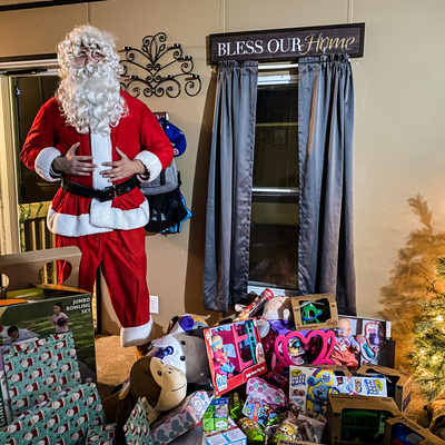 An ex Kansas Youth Sports athlete dressed up as Santa Claus for "The Big Give"