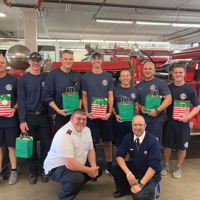 Handing out Christmas gifts to our local fire fighters.