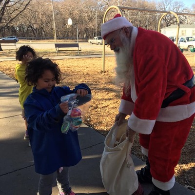 One of our first Christmas outings - giveaways in a North Salina neighborhood, circa 2014.